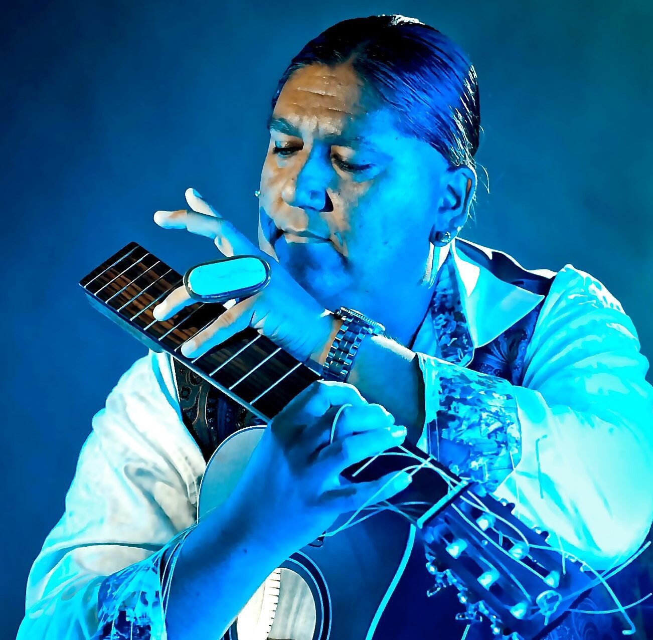 Gabriel Ayala playing a broken guitar