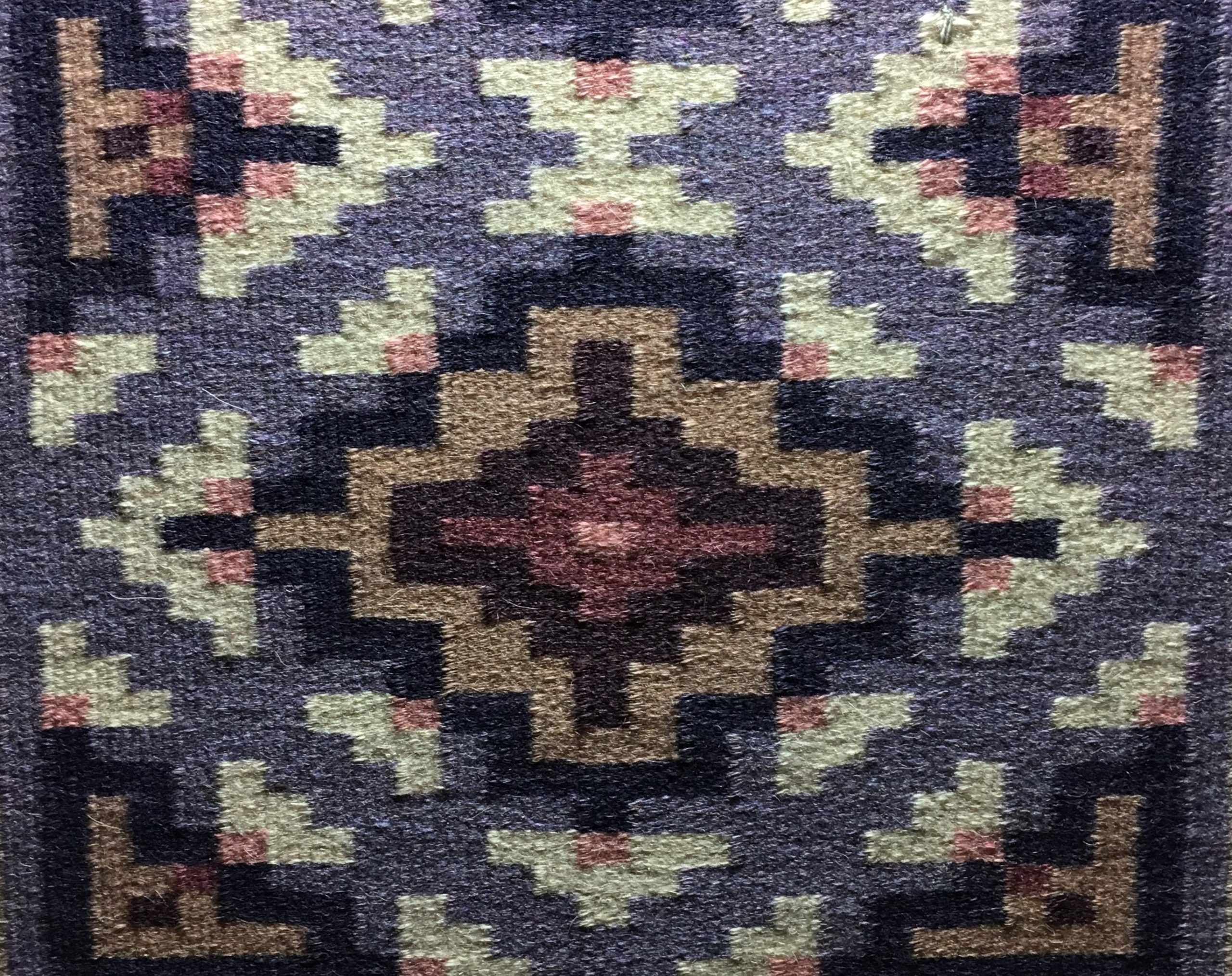 Weaving by Navajo Master Weaver Lynda Teller Pete, with geometric shapes in lavender, white, and light brown.