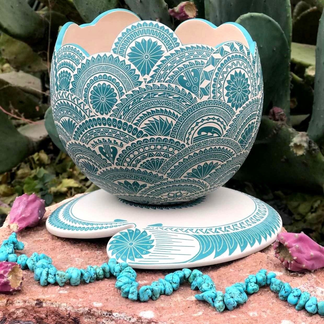A turquoise and white piece of Mata Ortiz pottery