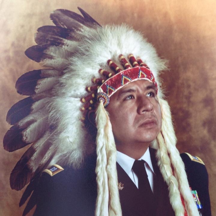 Warren Queton wearing his war bonnet